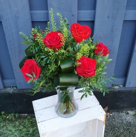 six roses in a vase